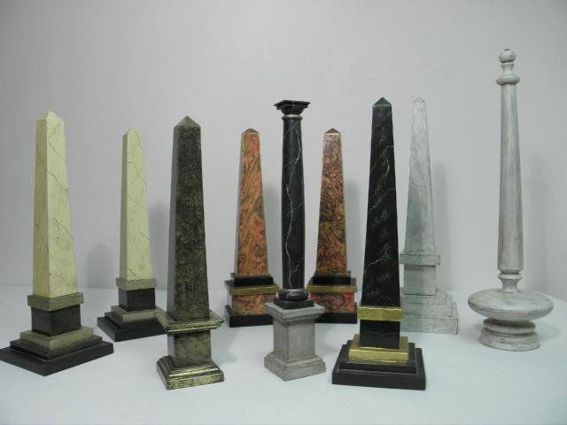 NINE ASSORTED HAND PAINTED OBELISKS: Lot of nine assorted faux finished and hand painted wooden obelisks. Includes a pair of 17.8" tall red/orange and gilt obelisks, a pair of 17.8" faux marble painted obelisks, an 18" tall faux marble p