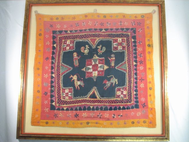 EARLY SOUTH AMERICAN EMBROIDERED TAPESTRY: A late 19th/early 20th century South American embroidered tapestry with various animals around a center medallion. Framed, matted, and under glass in a giltwood frame. Does not appear to be signed. Co