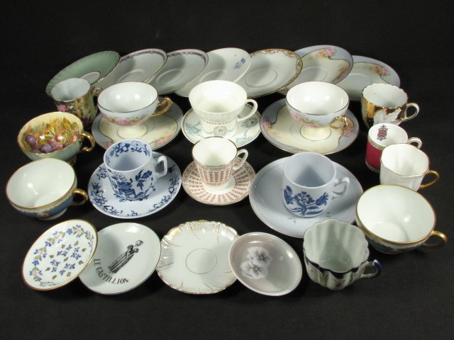 ASSORTED MIX OF MATCHED AND UNMATCHED CUPS AND SAUCERS: An assorted mix of matched and unmatched porcelain cups and saucers. Includes makers such as Shelley, Royal Rudolstadt, Royal Worcester, Spode, and more. Includes thirty-one total cups and saucers. Co