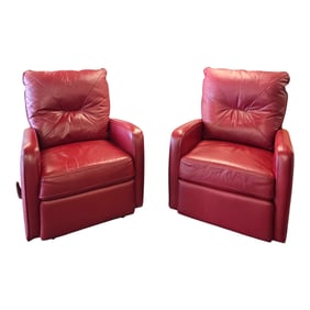 A PAIR OF RED LEATHER RECLINER CHAIRS