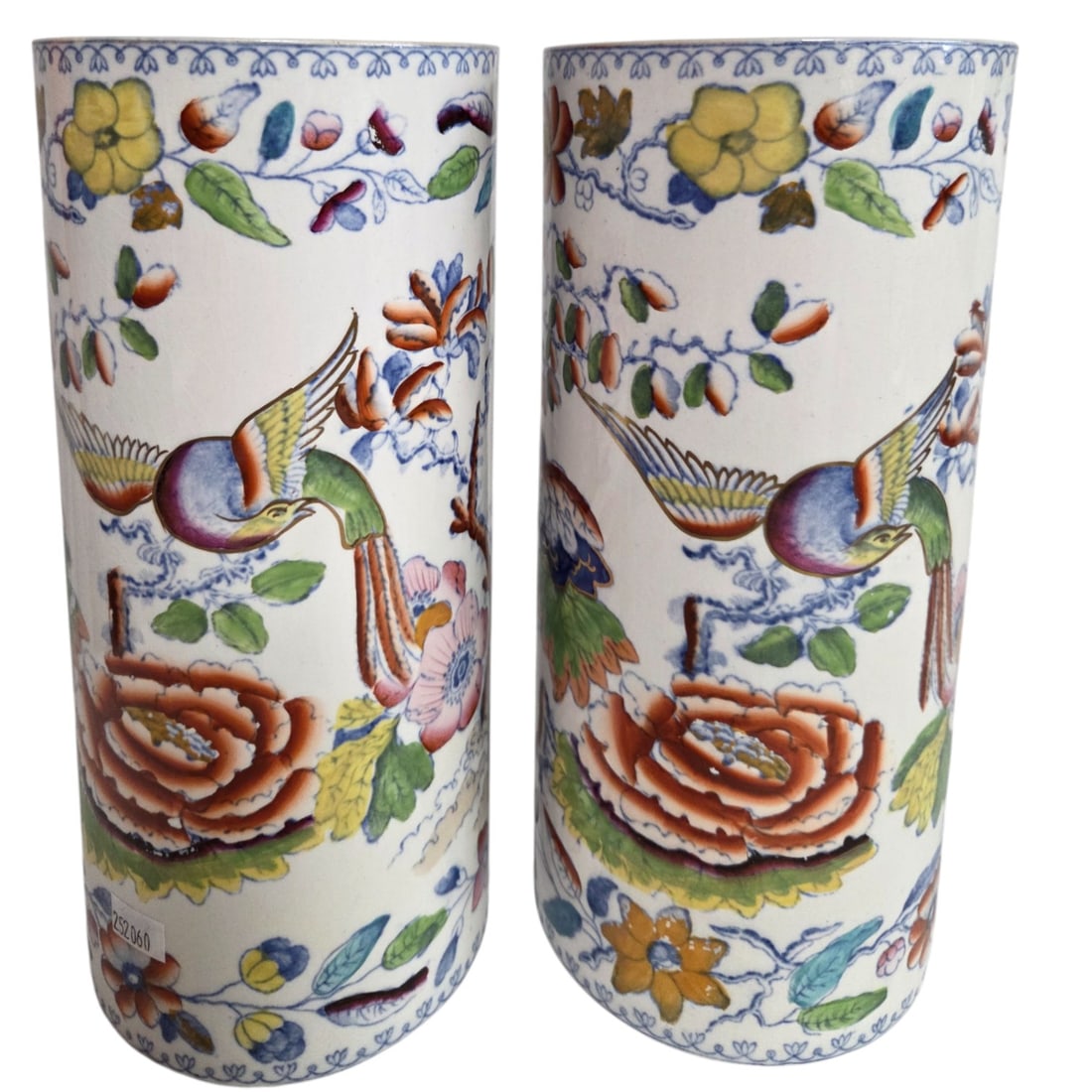 PAIR MASONS IRONSTONE CHINOISERIE CYLINDER VASES: A pair of Masons Ironstone chinoiserie decorated cylinder vases depicting a phoenix bird among trees and flowers. Measure 10.25" X 4.25"W. Stamp on bottom. Good condition.