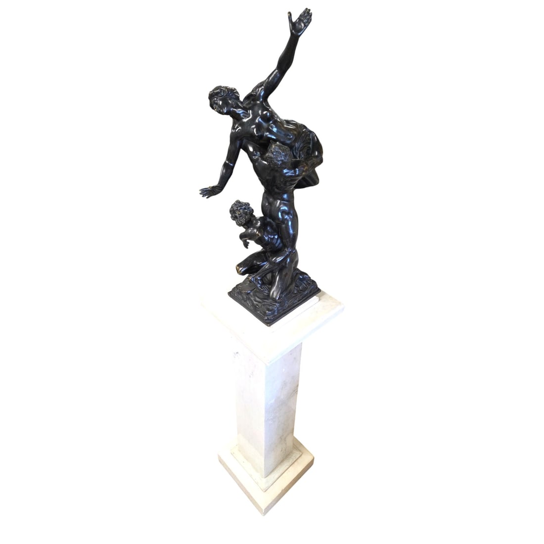 JEAN DE BOLOGNE RAPE OF SABINES BRONZE W/PEDESTAL: Bronze sculpture with brown patina titled Rape of Sabines by Jean de Bologne. Sculpture measures 24"H x 6.5" W x 8" D. Marble pedestal measures 35.5"H x 11"W x 11"D. Both in good condition with minor