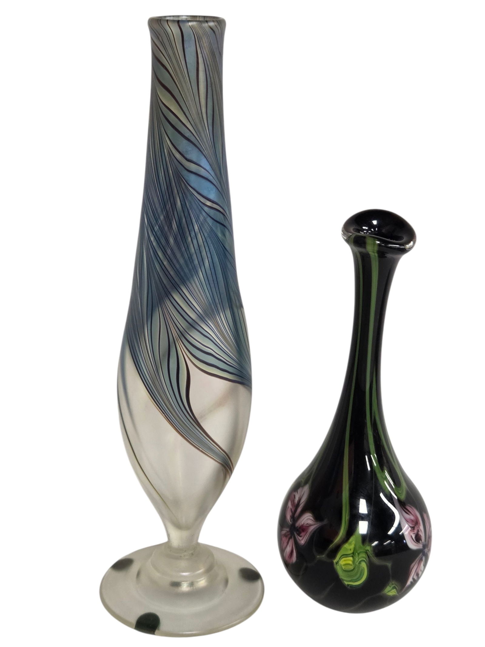 2 ART GLASS VASES-ARTIST SIGNED: Two art glass vases. Each with artist signature on bottom. Lot includes a black vase measuring 8"H x 3"W with purple and pink flowers joined by green stems- Signed by Richard Olma 1980. Condition is