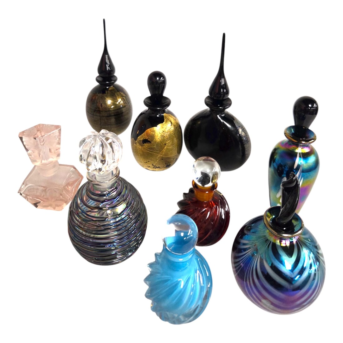A COLLECTION OF ART GLASS PERFUME BOTTLES 9 PC: Nine assorted 20th century decorative art glass perfume bottles. Most are blown glass, others pressed. All in good condition but for the small pink bottle with rose. It has a small chip on the edge