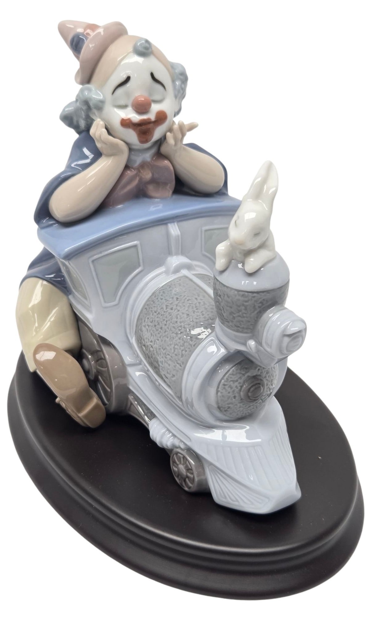 LLADRO CIRCUS EXPRESS PORCELAIN FIGURINE: LLadro "Circus Express" #8138. Porcelain figurine of a clown, train and small rabbit. Measuring 6" H x 5"W x 7"D. Stamp on bottom. Good condition-no chips, cracks, or visible repair. SHIPPING NOTE: