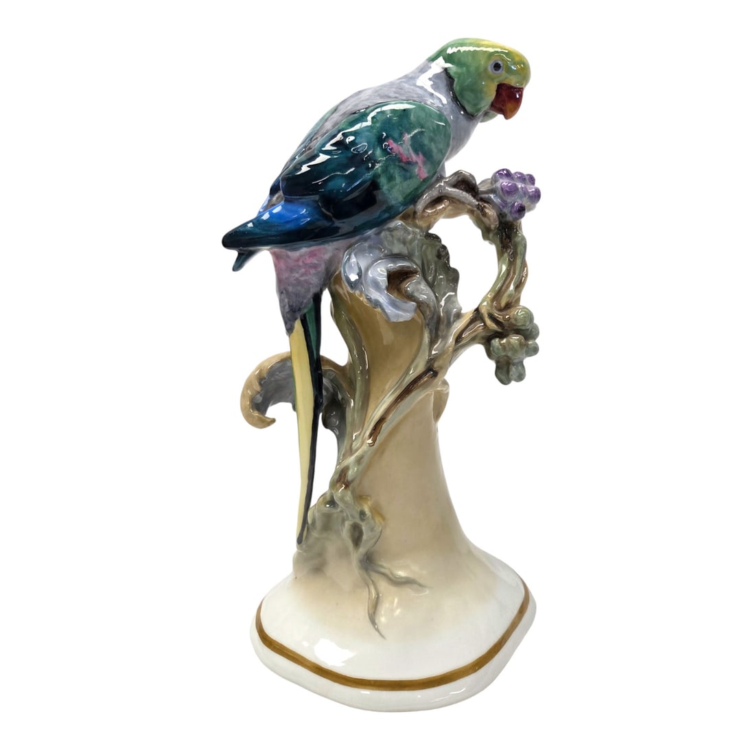 PORCELAIN PARROT BY KARL ENS FACTORY: Hand painted Porcelain parrot with Karl Ens factory windmill stamp on bottom. Measures 12.5" H x 6.5" W x 5" D. Good Condition. SHIPPING NOTE: Live Auctioneers offers a very convenient shipping