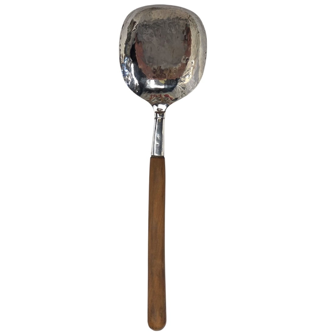 EXTRA LARGE HAMMERED STERLING SILVER SERV SPOON: An extra large sterling silver wood handled serving spoon. Condition: Good. Hallmarked 925. No apparent maker's mark. Measures approx. 13.25" long. Total Weight: 97gm SHIPPING NOTE: Live Auctioneers