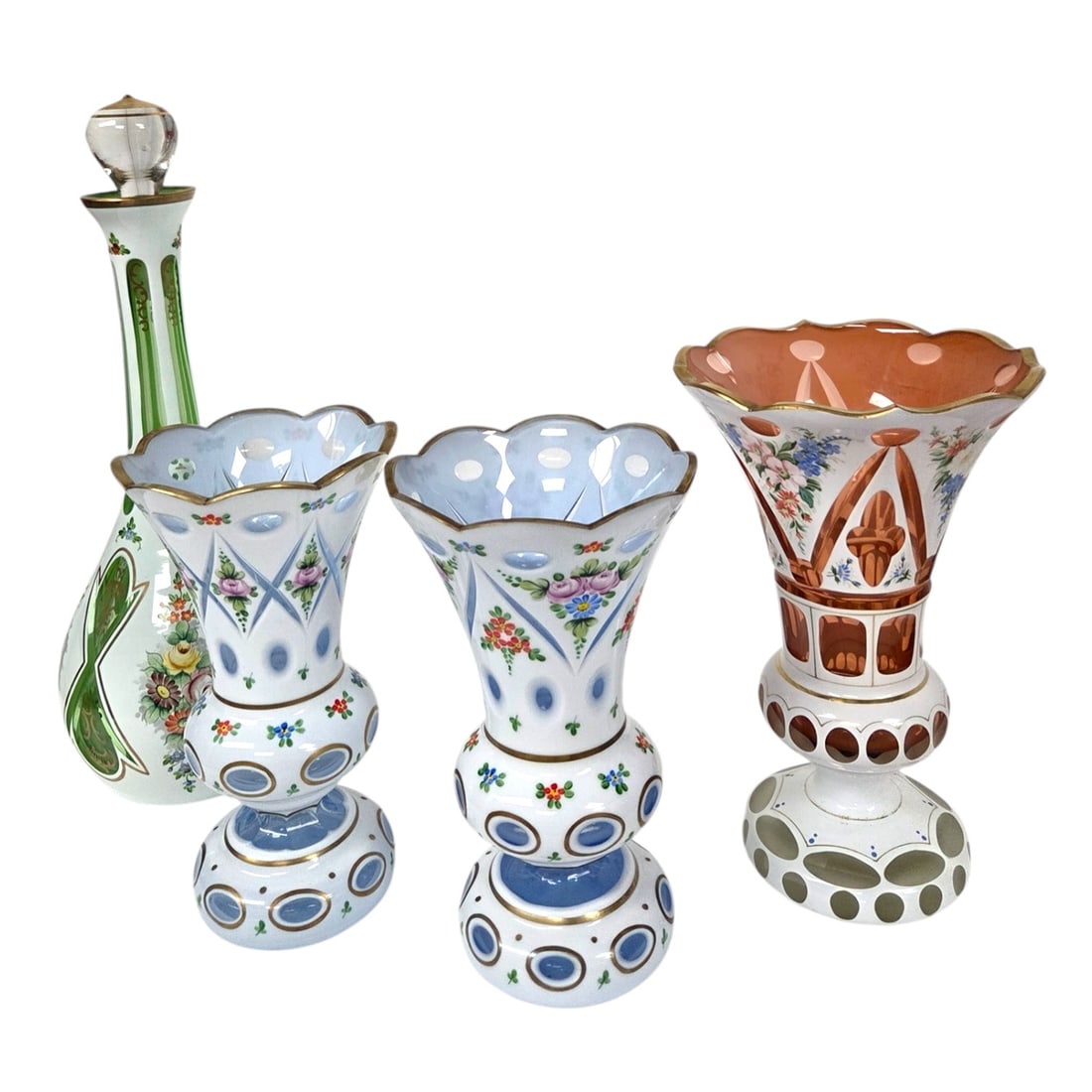 4 PIECES BOHEMIAN FLORAL DECORATED CASED GLASS: Two Blue Bohemian style cut to blue cased glass vases 8.5" x 5". One cut to peach glass vase 9.5" x 6" and one cut to green glass decanter 14.5" with stopper, 12.5" without stopper x 4.5". All with
