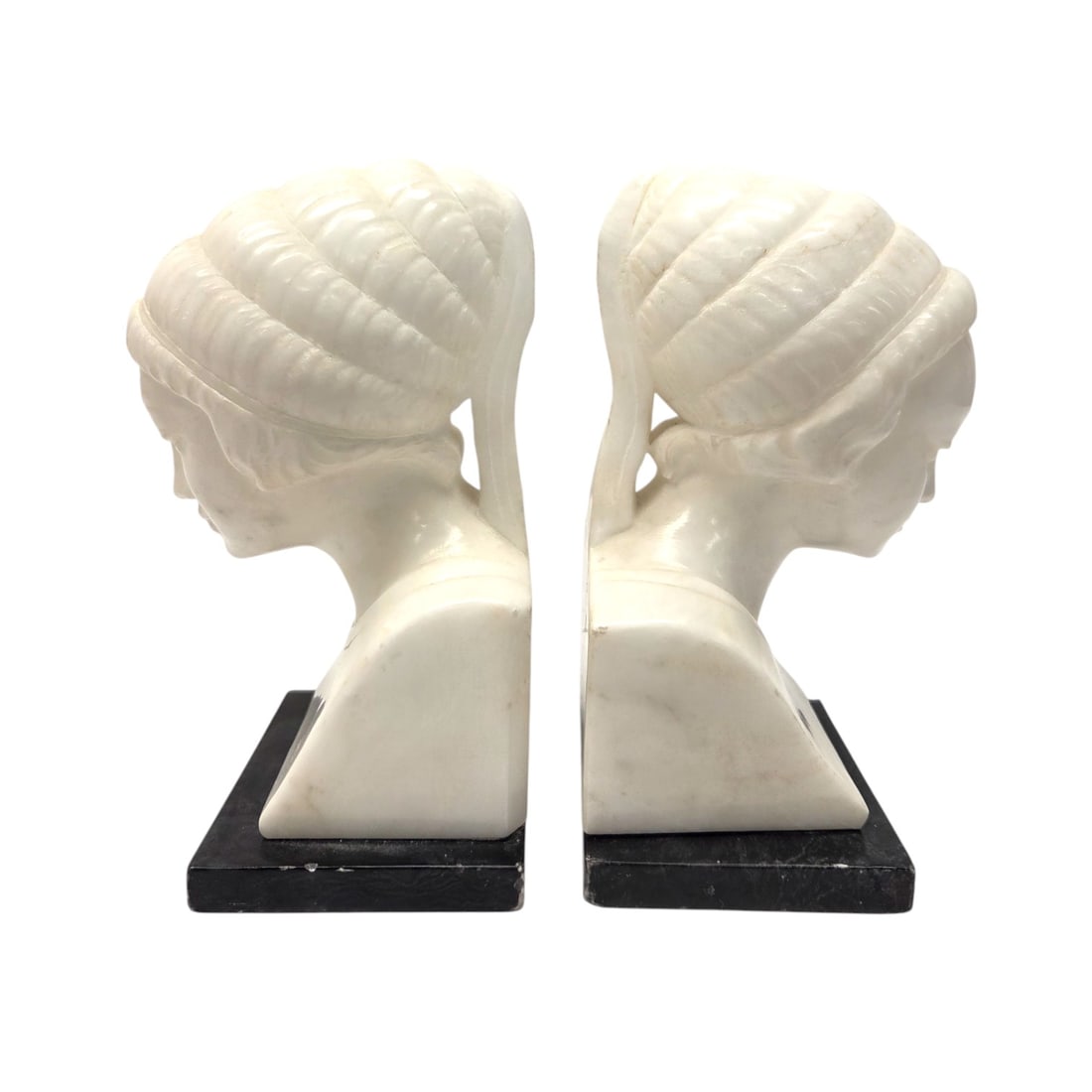 2 PC ART DECO ALABASTER WOMAN BUST BOOKENDS: Pair of Art Deco carved alabaster busts of women bookends on black marble base. Some damage to base. See photos. Measures 7"H x 3"W x 4" D. SHIPPING NOTE: Live Auctioneers offers a very convenient shi