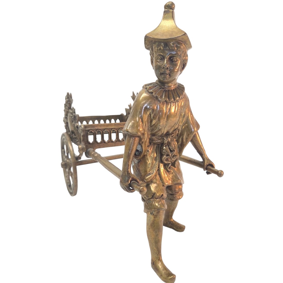 VINTAGE BRASS RICKSHAW FIGURINE: Brass rickshaw figurine measures 11" H x 13"W x 7"D. Good condition. Some wear on brass due to age. See photos. Wheels do turn. SHIPPING NOTE: Live Auctioneers offers a very convenient shipping