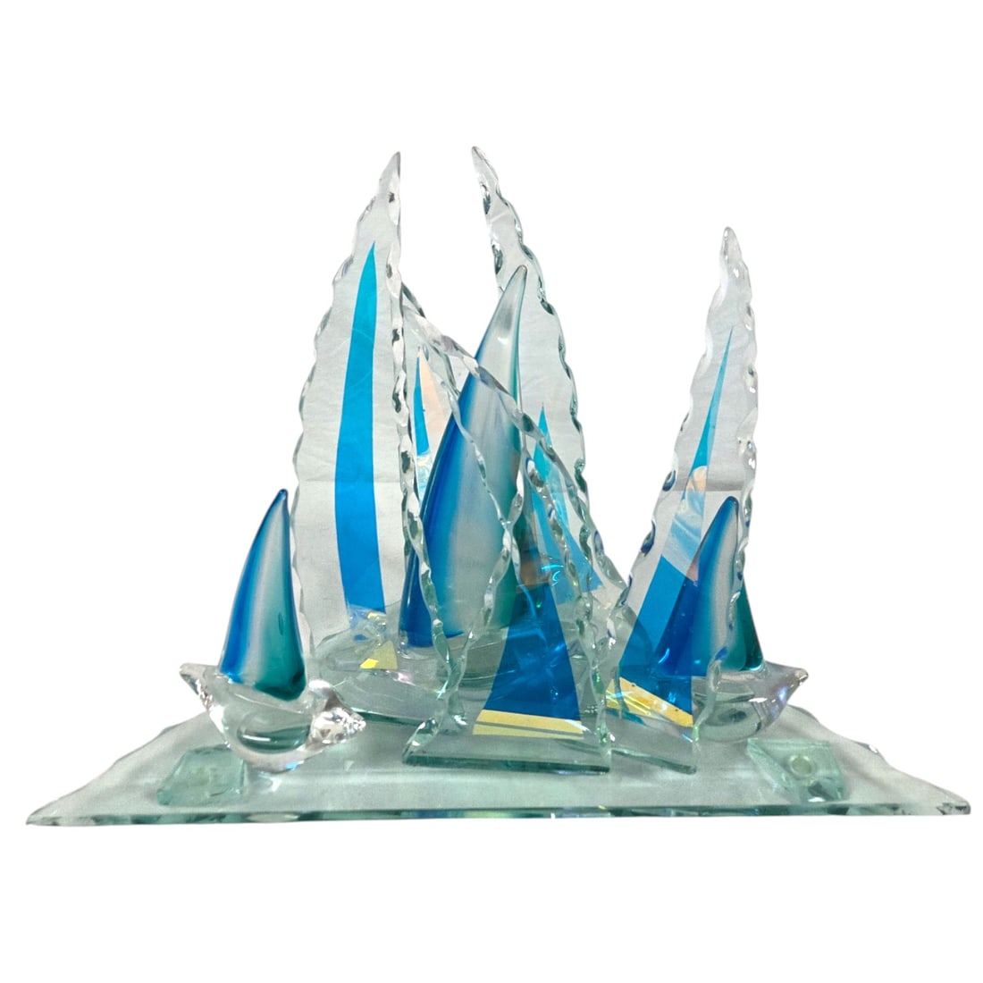 "COOL OCEAN BREEZE" GLASS SCULPTURE: "Cool Ocean Breeze" glass sculpture by Steve Brewster. Created with beautiful iridescent hues throughout the glass. Signed with title on left side of the base. Measures 15"H x19.75"W x 11"D. Good