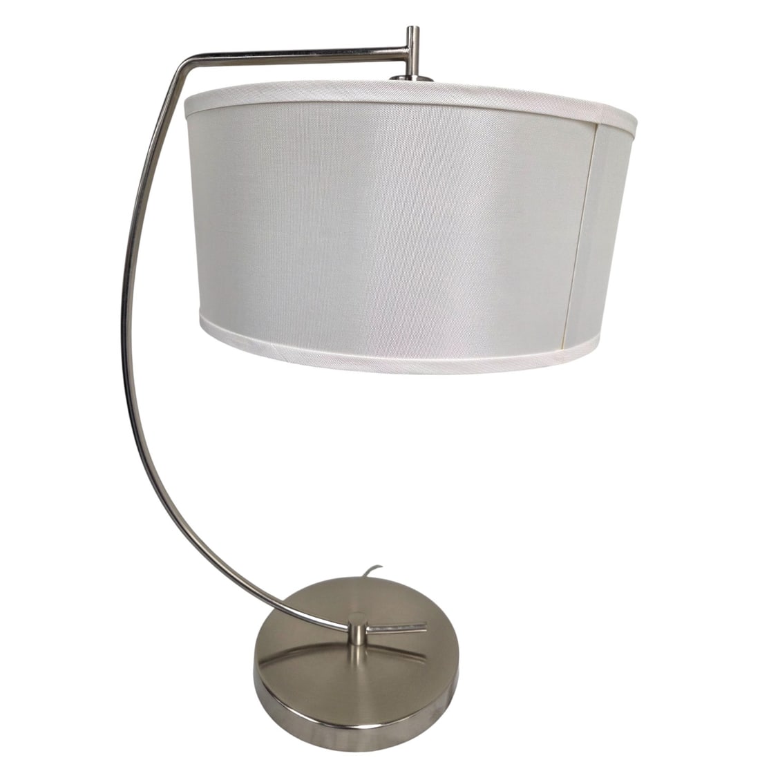 CURVED NICKEL FINISH TABLE LAMP WHITE SILK SHADE: Table lamp with semi-circle curved nickel body and brushed finish. White silk-style shade. Overall measures: 27.5" H x 9.5"W. Good condition with minor wear consistent with use. SHIPPING NOTE: Live