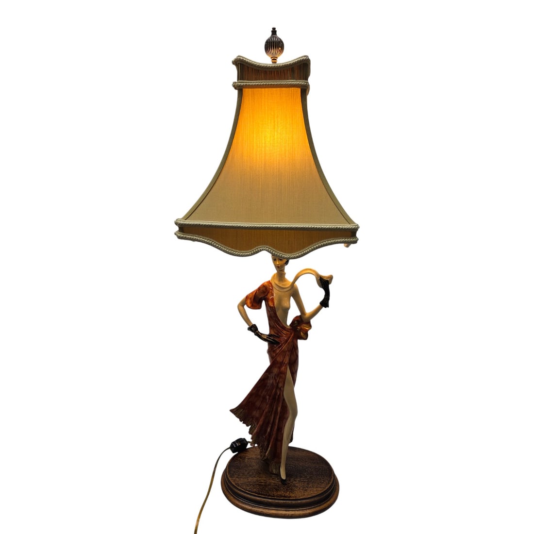 ART DECO STYLE (WOMAN) FIGURATIVE LAMP: Santini Art Deco Lamp. Limited edition, number 143/3500. Resin composition of stylish figure. Silk fabric "bell" shade, on wood base. Signed. Measures 31.5" x 10.5" W x 10.5"D. Lamp works, good