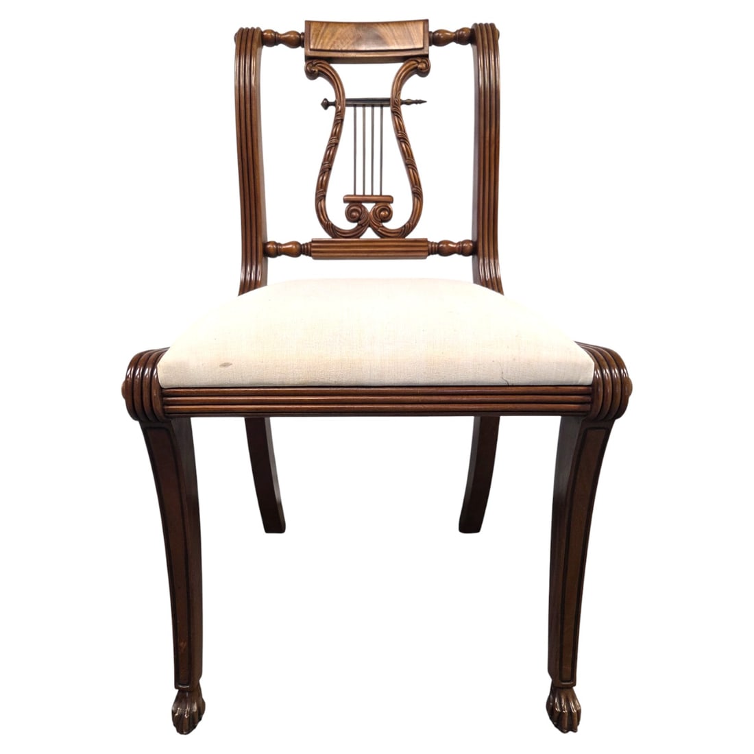 REGENCY STYLE HARP or LYRE BACK SIDE CHAIR: Vintage carved wood harp or lyre back side chair with cream/ivory upholstered sea and claw feet. Measures 34"H x 19"W x 16" D. small splash stains on rear of fabric seat. Easy to reupholstered drop