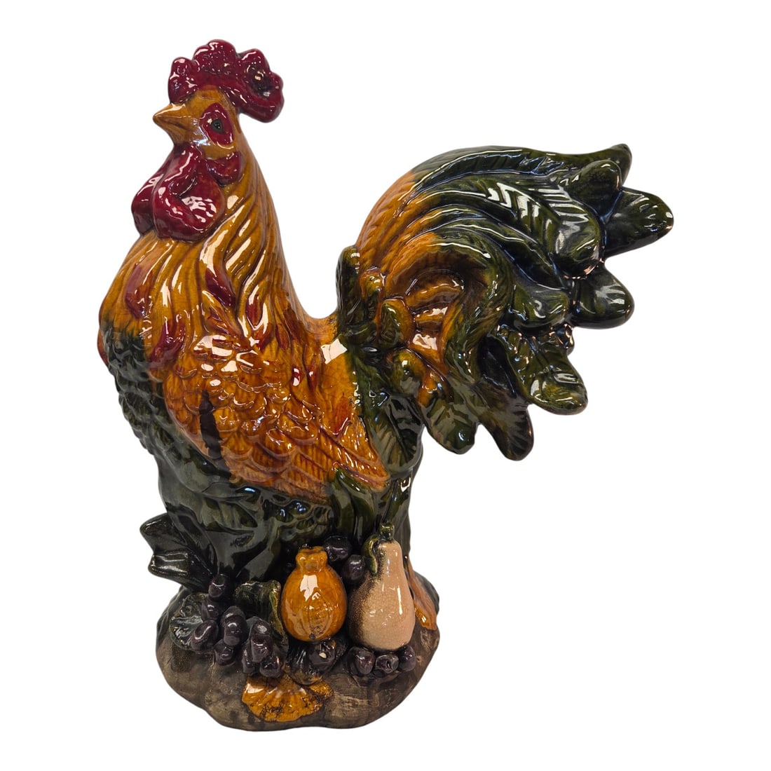 COLORFUL GLAZED CERAMIC ROOSTER FIGURINE: Large colorful painted ceramic rooster with decorative fruit on base. Measures 20"H x 16"W x 10"D. Small chip on base. See photos. Craquelure throughout glaze. No stamps or makers mark on bottom.