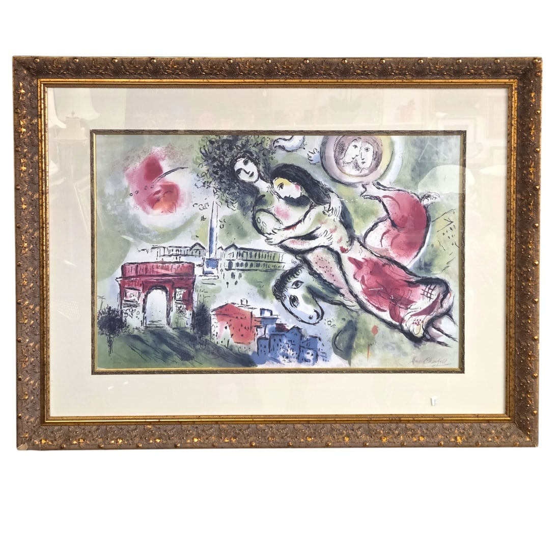 LARGE DECORATIVE CHAGALL LITHOGRAPH FRAMED: Large decorative Chagall offset lithograph signed in plate, framed, matted, and under glass. Mat with decorative inner edge. Sight size 23" x 36". Framed size 38" x 51" x 2". Small losses to frame at