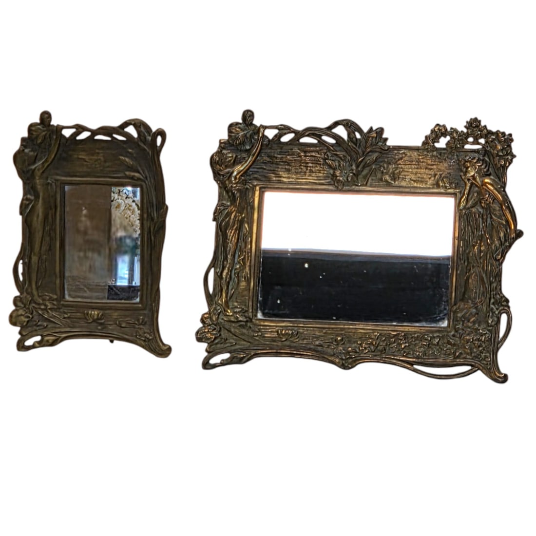 2 BRASS ART NOUVEAU W/ WOMEN FIGURE MIRRORS: Two brass Art Nouveau table mirrors depicting women figures and flowers. Vertical brass mirror measures 10" H x 7"W, and rectangular mirror measures 11.5" H x 14" W. Good condition.SHIPPING NOTE: