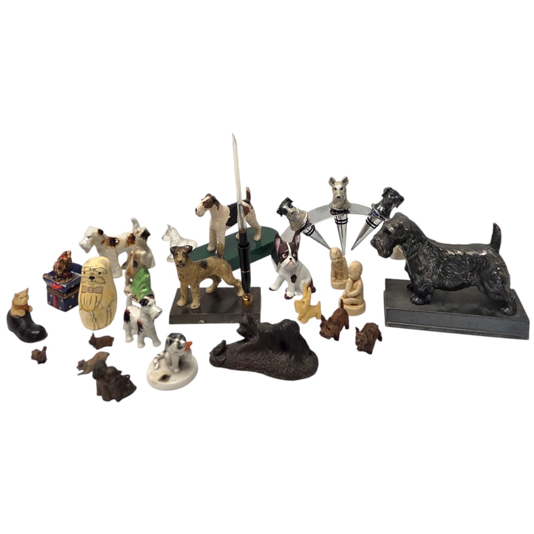 22 PC COLLECTION OF SCOTTIE DOGS & SMALL FIGURINES: A collection of figurines consisting mostly of Scottie dogs to include a pen holder, bottle stoppers, Limoge trinket box, and cat items. Good condition with normal signs of wear.SHIPPING NOTE: Live