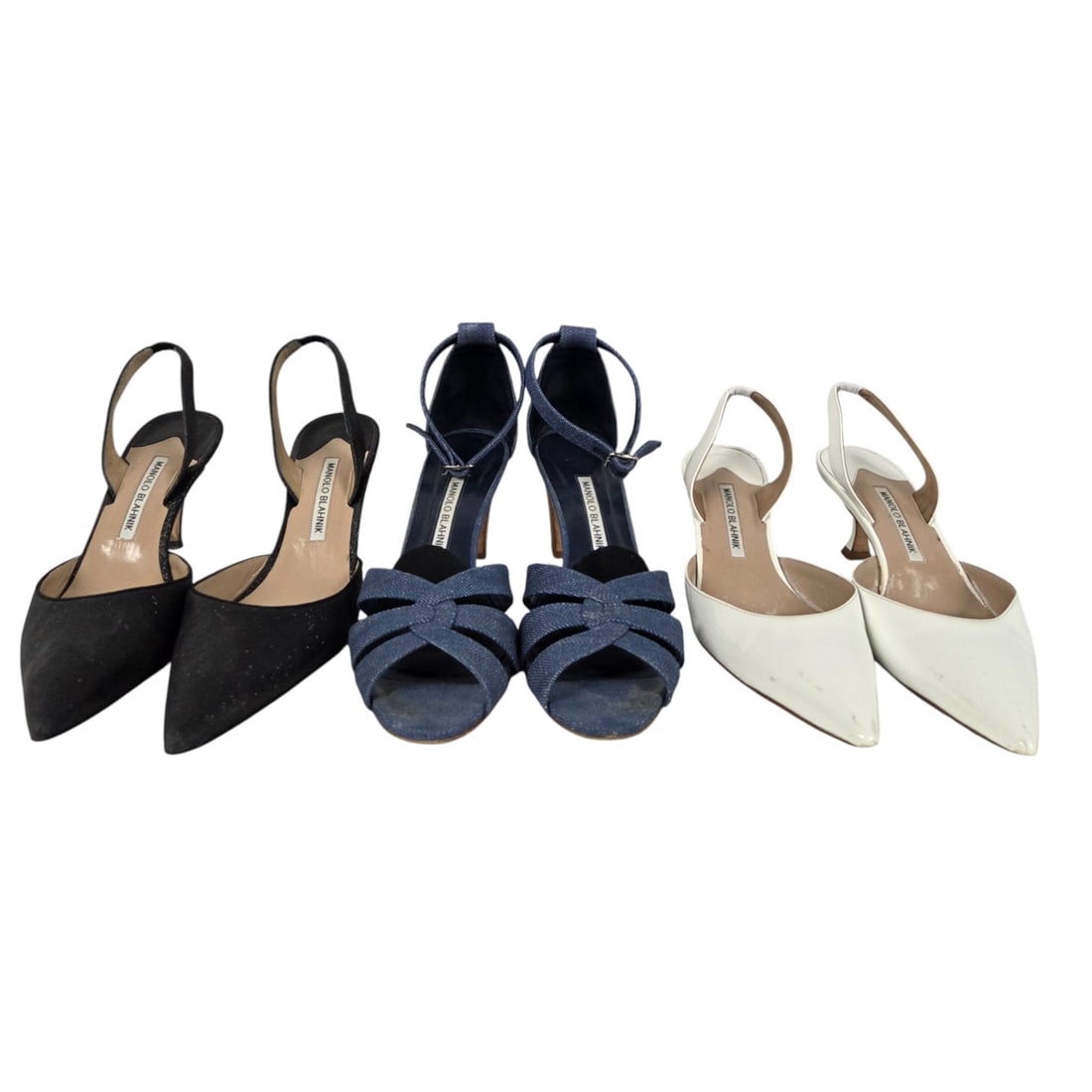 THREE PAIR LADIES MANOLO BLAHNIK SHOES: Three pair of ladies shoes consisting of: (1) pair of "Carolyne 70" black glitter fabric sling back pumps with a 3.5" stiletto heel. Size 40 ( 10) Good condition with minimal wear to the soles. (1)