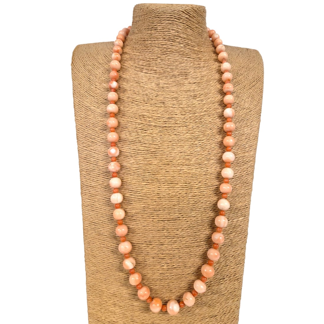 "ANGEL SKIN" CORAL NECKLACE: Vintage "Angel skin" coral necklace. Good condition and measures 14.5" in length when wearing. Gold clasp with secure snap. See photos. SHIPPING NOTE: Live Auctioneers offers a very convenient