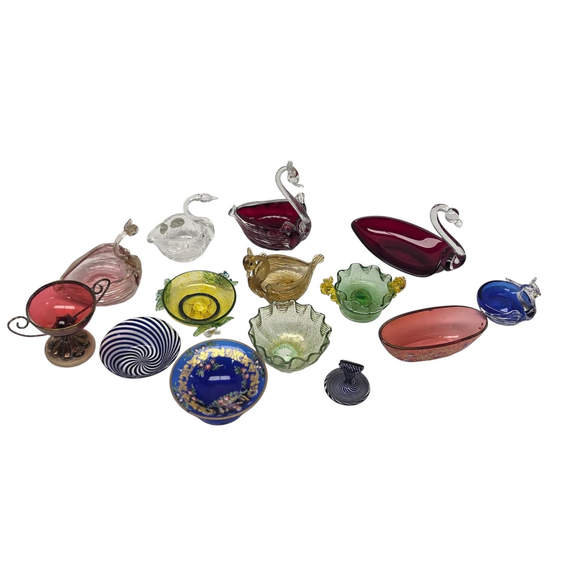 14 PC DECORATIVE GLASS SALT CELLARS: Fourteen piece lot of decorative glass salt cellars which includes Murano glass of 6 swans including Czech Republic Bohemia Crystal clear swan and 5 other decorative salts and one name tag holder. Lar