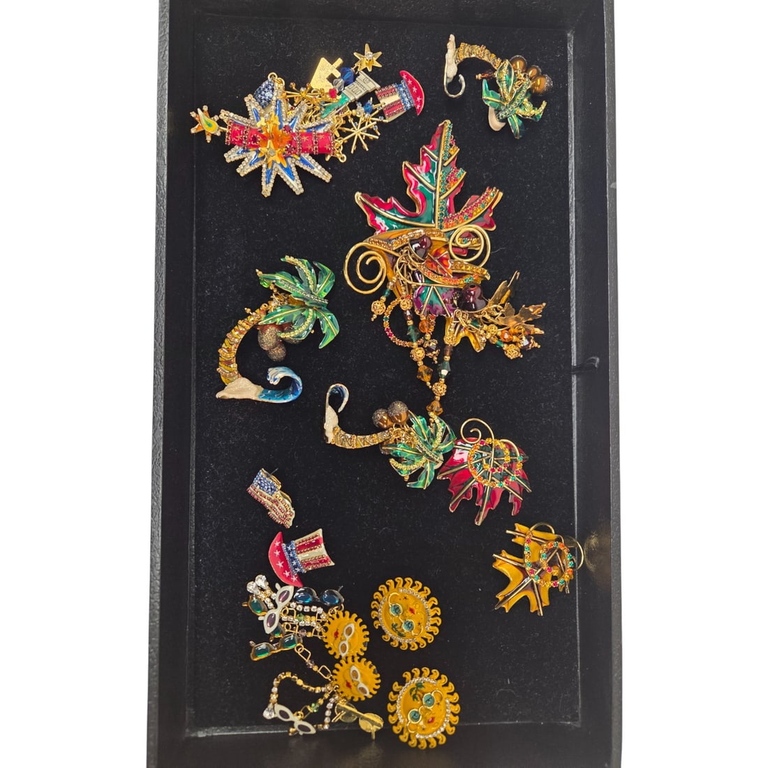 LOT OF 8 LUNCH AT THE RITZ PINS & EARRINGS: Lunch at the Ritz grouping consisting of: palm tree pin, sun clip earrings, sun (pierced) dangle earrings, leaf clip earrings, palm tree clip earrings, fireworks pin, Autumn leaves pin, and America ha