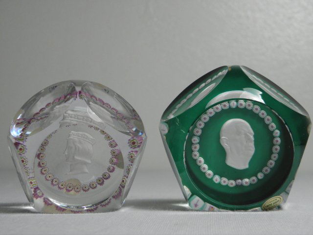 TWO ST. LOUIS CARVED SULPHIDE & CANE PAPERWEIGHTS: Lot of two St. Louis cane and carved sulphide paperweights. Both feature a central carved sulphide cameo surrounded by a ring of small canes, one over a green ground. Paperweight with the clear ground