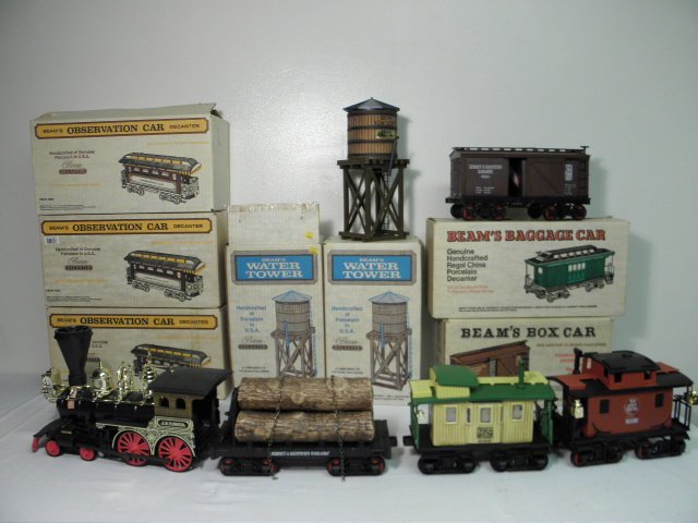 ASSORTED JIM BEAM TRAIN-FORM DECANTERS: 11 PCS: Lot of Jim Beam train-form decanters. Includes many styles, including the train engine and two water towers. Condition: all are in original boxes, boxes show signs of wear and age, see images for deta