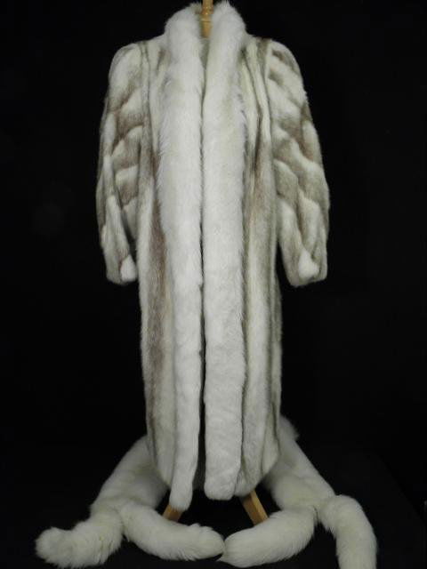 PAUL MAGDER FULL LENGTH MINK COAT & FOX FUR STOLE: Paul Magder full length striped ranched mink coat, sold along with a long white fox fur stole. Coat is personally embroidered under right side "Stella". Padded shoulders, satin lined, with four button
