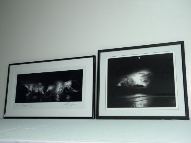 TWO WOODY WALTERS LIMITED EDITION FRAMED PHOTOGRAPHS: Lot of two limited edition framed photographs by Woody Walters. Includes "Moonrise Over Storm", titled on matting lower left, numbered on matting lower left "#134/250ec", marked in lower matting "HPA"