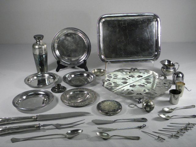 ASSORTED SILVER PLATED TABLEWARES: CHRISTOFLE, ETC.: Lot of assorted silver plated tablewares. Includes four Alexander Kach (Katsch) plates (2 sizes), a compact, two small shot glasses, two tea diffusers, a Christofle hotel-grade creamer (dented), a two