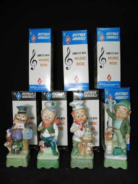 ELEVEN HOFFMAN ORIGINAL FIGURAL LIQUOR DECANTERS: Lot of eleven "Leprechaun" figural ceramic decanters by Hoffman Distilling Co. All but four are in original boxes. Condition: some wear to boxes, possible wear/losses to corks, see images. Decanters e