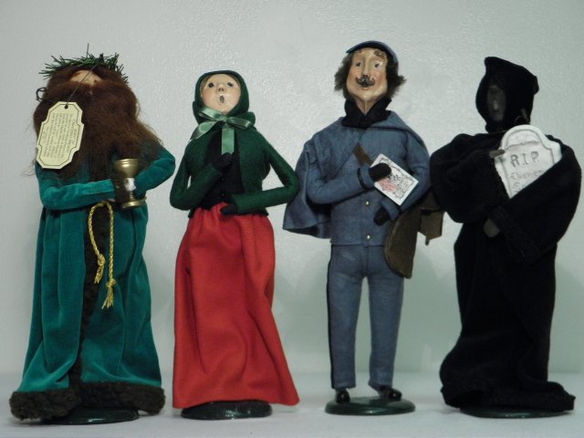 FOUR BYERS CHOICE FIGURES: A CHRISTMAS CAROL, ETC.: Lot of four Byers Choice holiday figures. Includes two "Carolers", "The Spirit of Christmas Future", and "The Spirit of Christmas Present". Condition: generally good, no apparent damages, see images. 