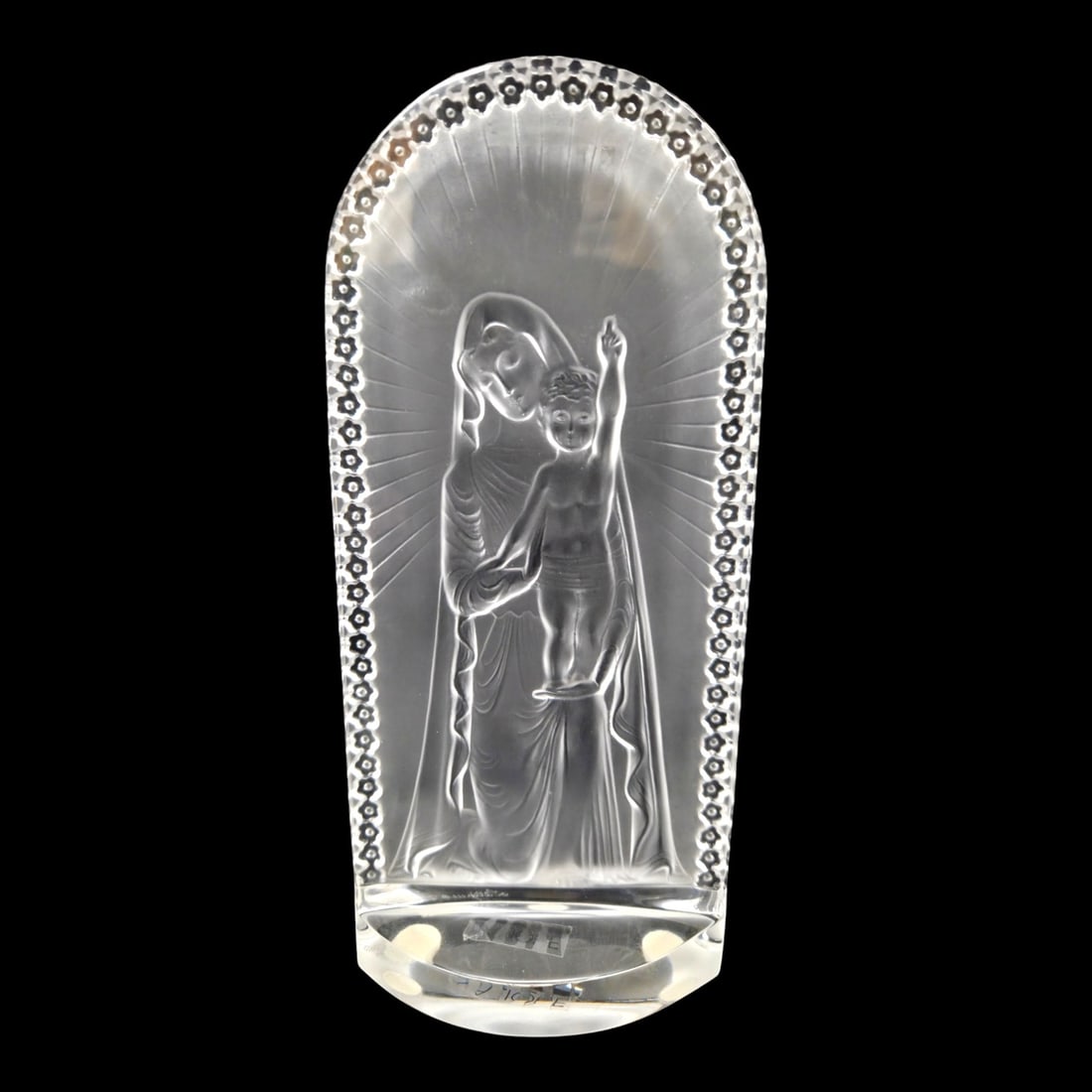 LALIQUE MADONNA & CHILD FROSTED CRYSTAL STANDING PLAQUE: Lalique frosted crystal Madonna and Child standing plaque featuring a detailed high-relief depiction of the Virgin Mary holding the infant Jesus. Signed. Measures 8 H x 3.5 W. Good condition. See phot
