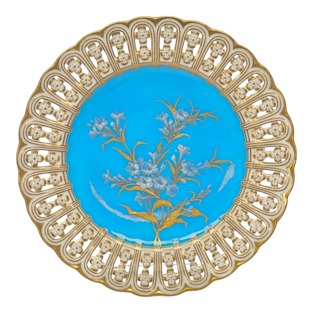 MINTONS RETICULATED 'PATE SUR PATE' PAINTED PLATE: A stunning Mintons Circa 1873-1902 hand painted Pate sur Pate floral decorative plate, featuring a vibrant blue background with intricate floral designs in delicate white and gold. The plate measures 