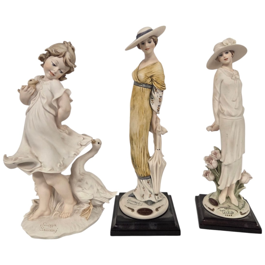 GROUP OF THREE GIUSEPPE ARMANI FIGURINES (1 of 12)
