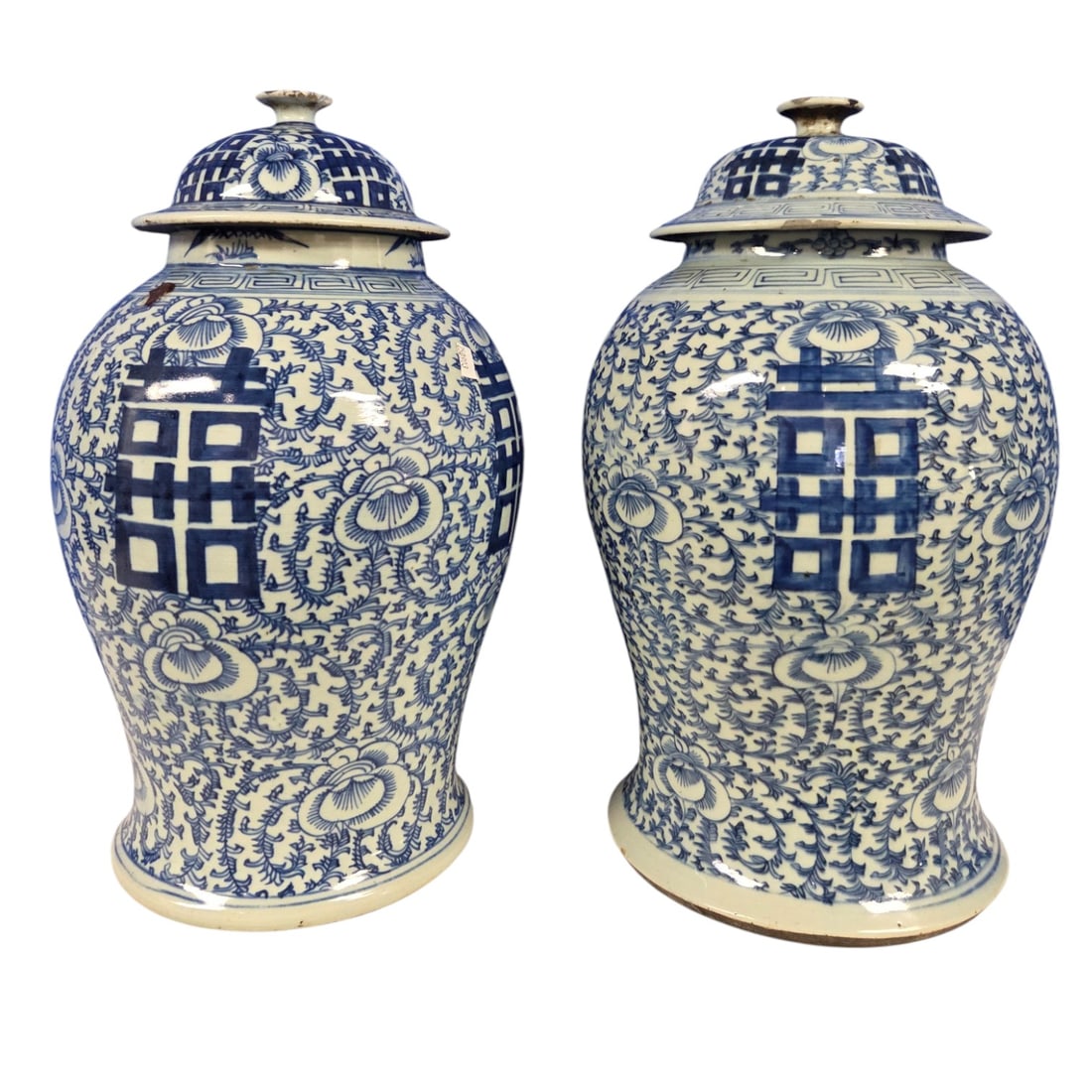 PAIR TALL CHINESE DOUBLE HAPPINESS TEMPLE GINGER JARS: Pair of blue and white Chinese Double Happiness Temple jars or Ginger jars under glazed with a pattern of scrolling vines and flowers. Character marks on bottom translates to Made in the Chenghua Nian