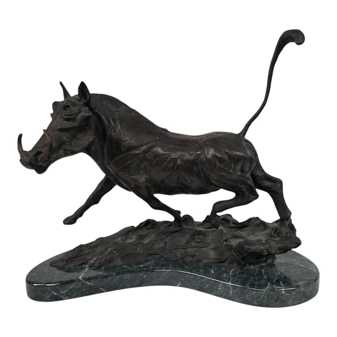 "WARTHOG STUDY" BRONZE BY GEOFFREY C. SMITH: Limited Edition 19/30 Bronze sculpture on marble base by Geoffrey Camp Smith (American, b. 1961) titled Warthog Study. Signed and dated 1990 on back. Good condition. See photos. Measures 14 H x 17 W x