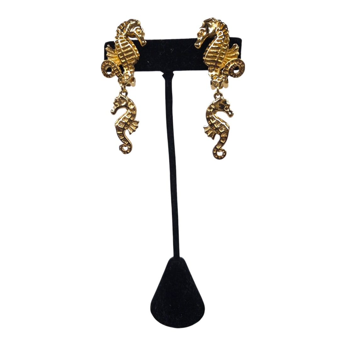 CHRISTIAN DIOR GP SEAHORSE CLIP EARRINGS: Signed Christian Dior pair of gold plated, relief, double seahorse clip earrings circa late 1970 s-early 1980 s. Good condition with no sign of surface wear or repair. Measures 2