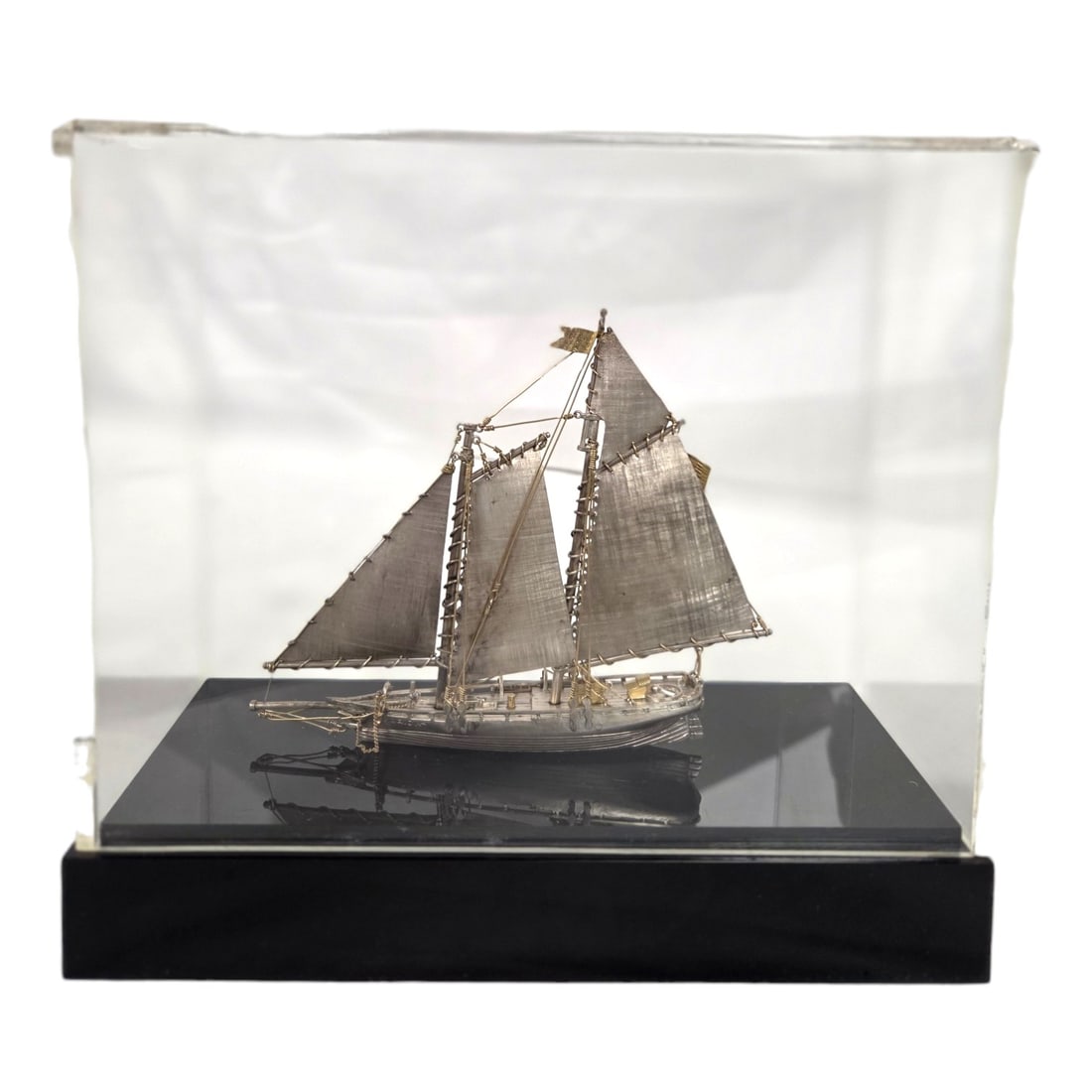 "AMERICA" SMALL SILVER L.E. SHIP BY JANNA THOMAS: America limited edition 44/200 silver miniature yacht by designer Janna Thomas de Velarde from Taxco, Mexico. Janna was internationally known for her silver work and previously designed for Tiffanty& 