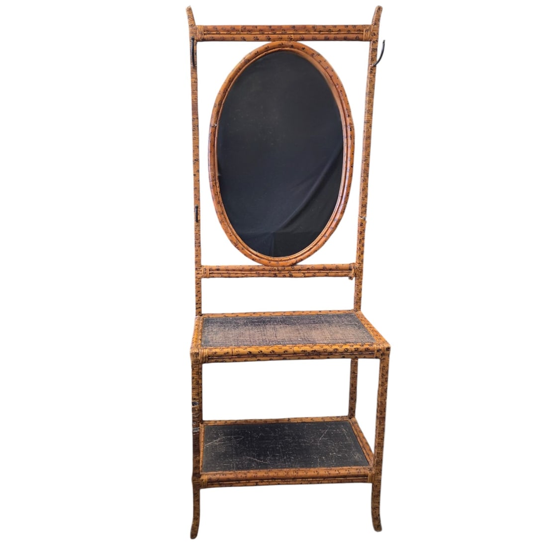 BAMBOO HALL TREE WITH OVAL MIRROR: Bamboo hall tree with built in oval mirror and storage shelves. These stands were specifically designed for front entryways to hold hats and coats. Built from natural bamboo, rattan binding straps, an