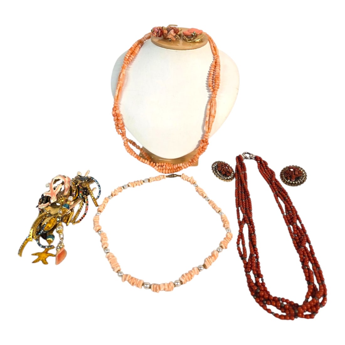 CORAL AND SEA INSPIRED JEWELRY LOT: Five pieces coral and sea inspired jewelry: 1) A natural salmon-colored coral necklace with filigree metal clasp 20 . 2) A natural raw Angel Skin coral and faux pearl necklace 18 . 3) A floral-shaped 