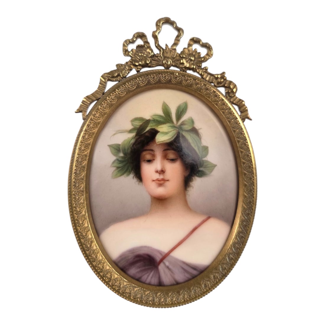 MINIATURE "DAPHNE"PAINTING ON PORCELAIN: Antique ornately framed painting on porcelain depicting a woman wearing a laurel wreath characteristic of the nymph Daphne from Greek mythology. Piece is signed Wagner on lower right and likely