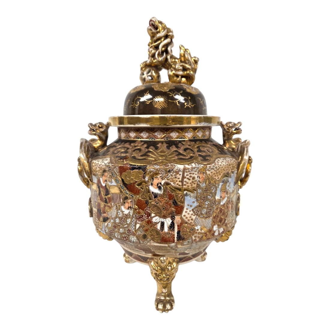 JAPANESE MEIJI COVERED INCENSE BURNER W/FOO DOG FINIAL: Japanese Meiji period (1868-1912) porcelain incense burner with a dark glaze and gold decoration. The lid is surmounted by a Foo Dog finial with it s paw resting on a pierced sphere. Warrior figures a