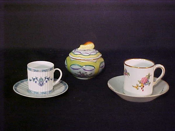 GROUP LIMOGES SEVRES PORCELAIN PIECES: Blue and white demitasse Limoges cup and saucer measuring 4 5/8", Aloudin yellow covered dish 2 3/8" high X 2 /4" wide and Sevres cup 3 1/2" wide x 2 3/4" high and saucer 5 1/4" in diameter. Tiny chip