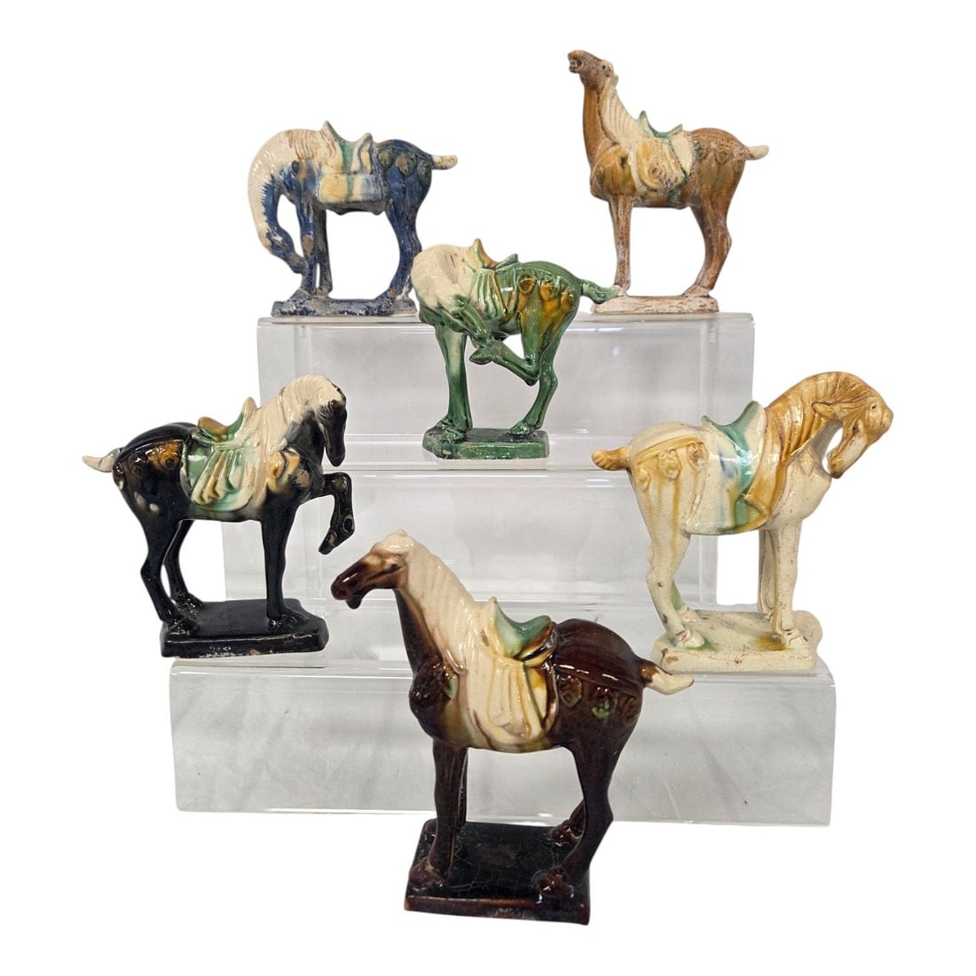 SET OF 6 CHINESE SANCAI STYLE POTTERY HORSES: Set of 6 Sancai style pottery horse figurines. The horses feature the classic Sancai (three color) glaze technique which historically combined amber, yellow, greeen, cream and blue. They exhibit