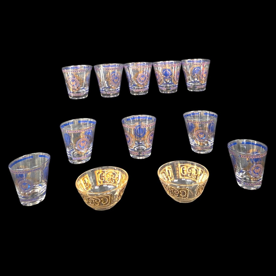 10 GEORGES BRIARD GLASSES W/2 BOWLS: Glass grouping consisting of: 10 George Briard double old fashioned glasses showcasing a beautiful blend of cobalt blue and gold tone filigree adorned with a Romanesque medallion framing of a