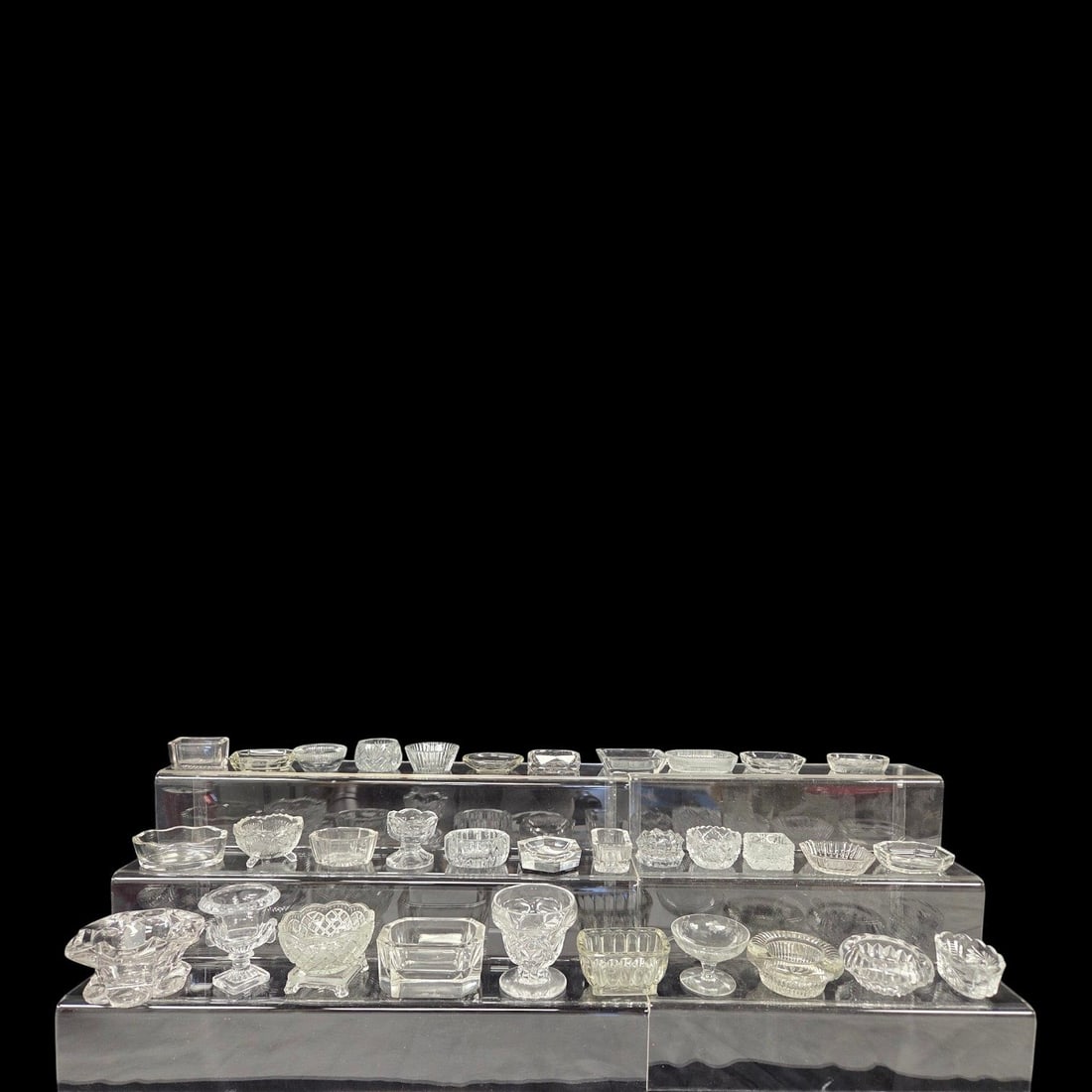 32 PC LOT OF GLASS SALT CELLARS: 35 Piece collection of Cellar salts. Includes various pressed and cut glass, small and master salts. good condition.