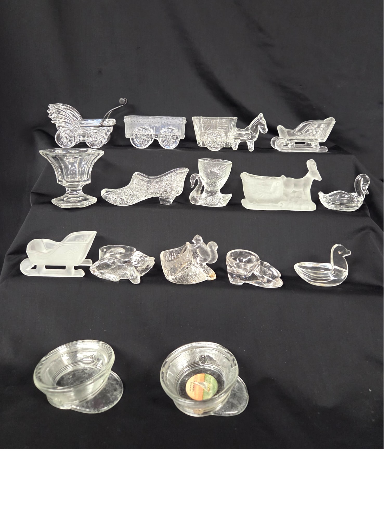 16 PC LOT OF GLASS SALT CELLARS: 16 Piece lot of assorted (mostly figurative) glass salt cellars. Some smaller salts and some master. Good condition. See photos.