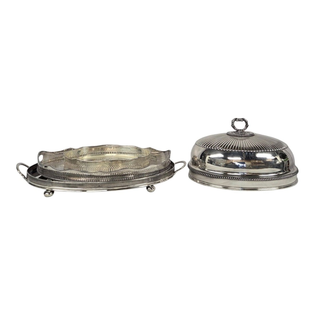 4 PC SILVER GROUPING OF 3 PLATED TRAYS & DOME LID COVER: This four piece silver plated grouping consists of: an oval Mottahedeh silver plate tray with reticulated gallery boarder and cut out handles. Stamp on botttom. Measures 2 H x 14.5 W x 11 D, Barker El